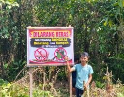 Antisipasi Pencemaran Lingkungan, Pemdes Ononamolo III Kubur Bangkai Babi di Sungai dan Pasang Spanduk Larangan